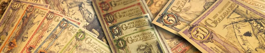 Goldbacks bulk collection display - Assorted premium gold currency notes from multiple states